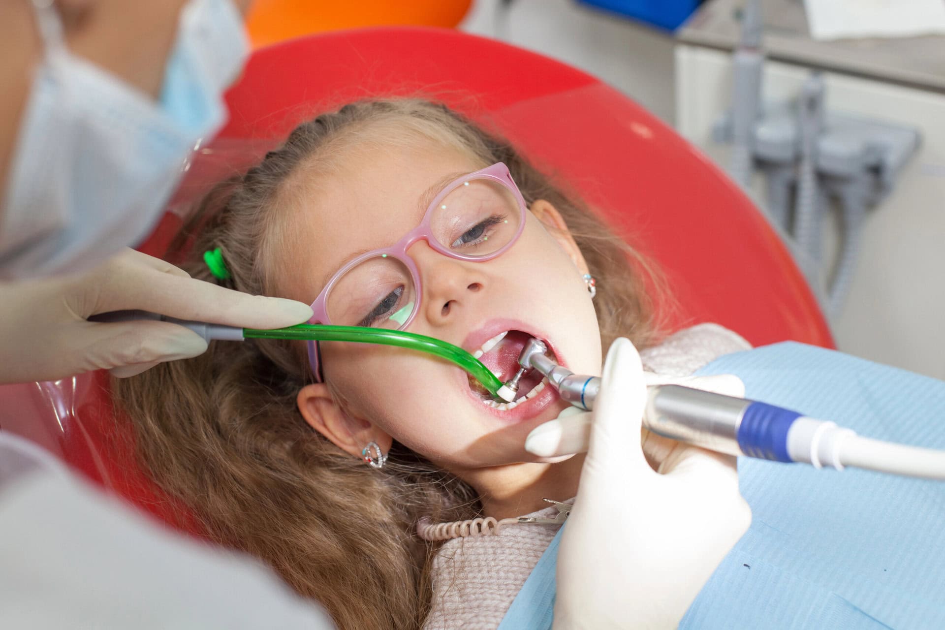 A child with a dentist in a dental office